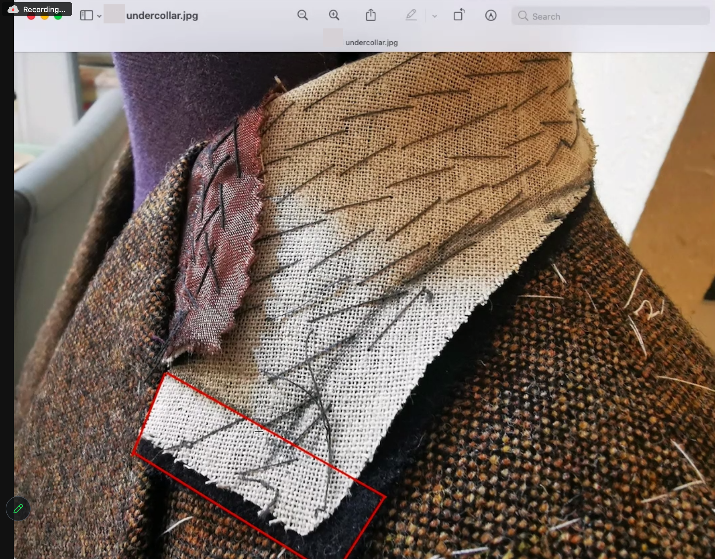 An under collar, marked for proposed adjustments following the forward fitting.